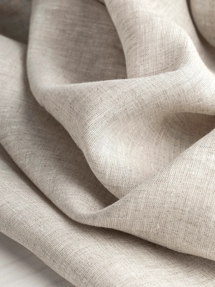 Close-up of natural linen fabric in soft folds